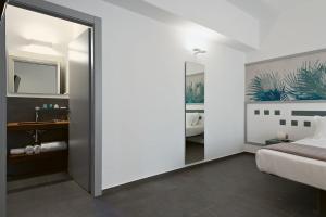 Postel nebo postele na pokoji v ubytování nautilus b&b suite design