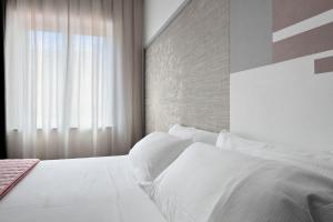 Postel nebo postele na pokoji v ubytování nautilus b&b suite design