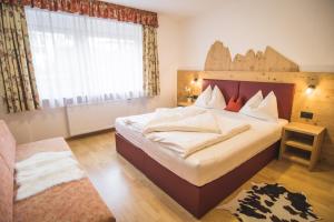 Posteľ alebo postele v izbe v ubytovaní Residence Sisi