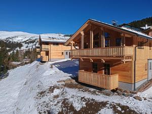 a log house on top of a snow covered mountain at Jagdhütte in Lachtal