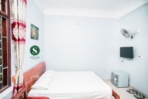 Ліжко або ліжка в номері Nhat Son Guesthouse