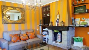 a living room with a couch and a fireplace at Legado De Zabala, Casa Rural in Laguardia