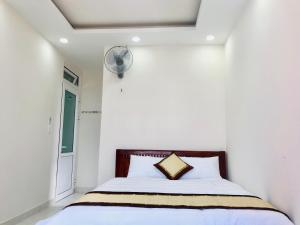 Postel nebo postele na pokoji v ubytování Mai Ngoc Hotel