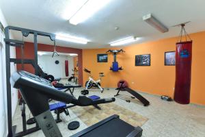 a gym with several exercise equipment in a room at Hotel Ida in Bansko +130 photos