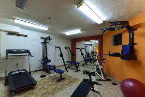 a gym with several tread machines in a room at Hotel Ida in Bansko +133 photos