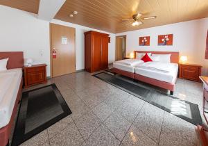 Postel nebo postele na pokoji v ubytování Hotel Avalon + 9 fotografií