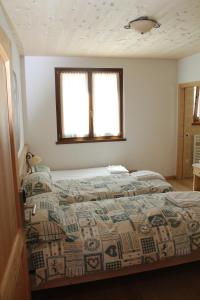 Posteľ alebo postele v izbe v ubytovaní Agritur Maso Rauter
