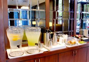 a buffet with glasses of drinks on a counter at The Ridge in New York