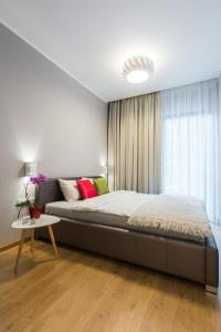 Кровать или кровати в номере Pawia Apartments Modern