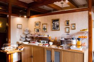 a kitchen with a counter with food on it at Hotel Atlanta in Amsterdam
