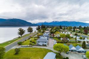 an aerial view of a small town next to a lake at Lakeside Motel & Apartments in Te Anau