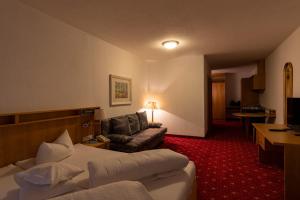 Postel nebo postele na pokoji v ubytování Hotel Bruggner Stub`n