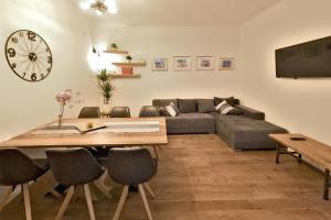 a living room with a couch and a table at Apartment Rest in The Best in Zagreb