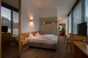 Postel nebo postele na pokoji v ubytování Hotel Bruggner Stub`n
