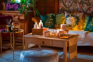 a bedroom with a bed and a table with a table at Villa Botanica in Mirkovec