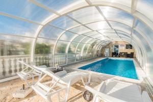 an indoor swimming pool with an arched ceiling at Apartment Crikvenica, Vinodol 5 in Crikvenica