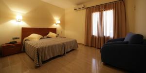 Posteľ alebo postele v izbe v ubytovaní Hotel Sa Riera