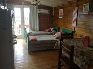 Ένα ή περισσότερα κρεβάτια σε δωμάτιο στο CABAÑAS LA GUADALUPE