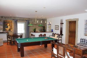 a living room with a pool table in it at Casa do Nato -Turismo Rural in Viana do Castelo