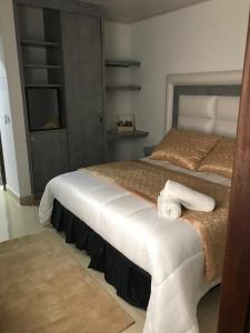 Postel nebo postele na pokoji v ubytování Hotel San Antonio Guarne