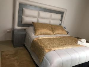 Postel nebo postele na pokoji v ubytování Hotel San Antonio Guarne