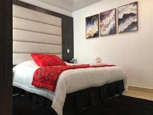Postel nebo postele na pokoji v ubytování Hotel San Antonio Guarne