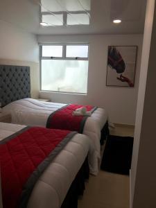 Postel nebo postele na pokoji v ubytování Hotel San Antonio Guarne