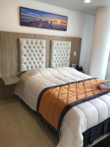 Postel nebo postele na pokoji v ubytování Hotel San Antonio Guarne
