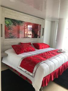 Postel nebo postele na pokoji v ubytování Hotel San Antonio Guarne
