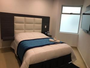 Postel nebo postele na pokoji v ubytování Hotel San Antonio Guarne