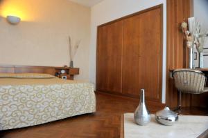 Postel nebo postele na pokoji v ubytování Grand Hotel Golf