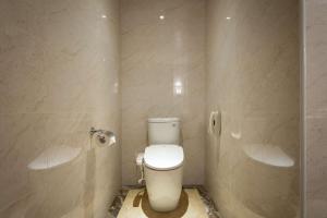 a bathroom with a toilet and a shower at Lailai Hotel in Taichung