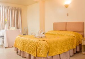 Voodi või voodid majutusasutuse Benguet Prime Hotel toas