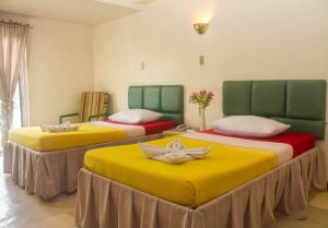 Voodi või voodid majutusasutuse Benguet Prime Hotel toas