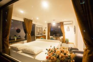 Voodi või voodid majutusasutuse Dinh Ami Hanoi Hotel toas