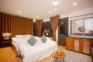 Voodi või voodid majutusasutuse Dinh Ami Hanoi Hotel toas