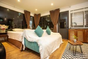 Voodi või voodid majutusasutuse Dinh Ami Hanoi Hotel toas
