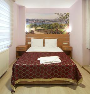 Postel nebo postele na pokoji v ubytování Hotel Akcinar