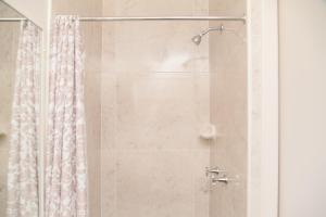 a bathroom with a shower with a shower curtain at Southside Holiday Village in Rockhampton