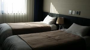 Postel nebo postele na pokoji v ubytování Seawater Spa Hotel Coza