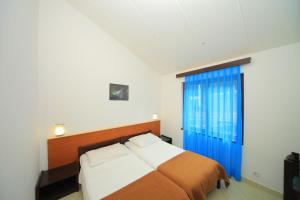 Katil atau katil-katil dalam bilik di Apartments Kanegra Plava Laguna
