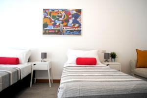 Posteľ alebo postele v izbe v ubytovaní BNBOOK - Galbiati Flat