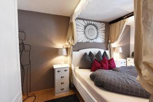 a small bedroom with a bed and a window at Apartment Fernerkogel in Gries im Sellrain