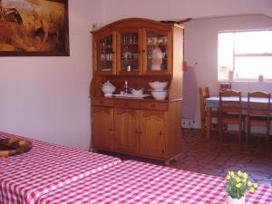a kitchen with a sink and a wooden cabinet at Thekwane Holiday House in Klipdrift