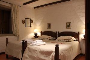 Postel nebo postele na pokoji v ubytování Casa do Nato -Turismo Rural