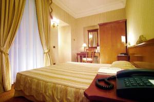 Postel nebo postele na pokoji v ubytování BB Hotels Smarthotel Bailey's