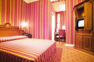 Postel nebo postele na pokoji v ubytování BB Hotels Smarthotel Bailey's