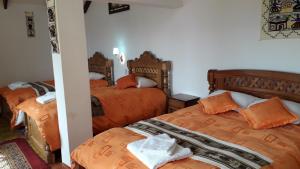 Katil atau katil-katil dalam bilik di Hostal Jallalla