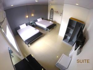 Letto o letti in una camera di GC Suites