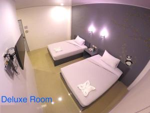 Letto o letti in una camera di GC Suites